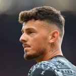MANCHESTER, ENGLAND - MAY 12: Ben White of Arsenal looks on as he warms up prior to the Premier League match between Manchester United and Arsenal FC at Old Trafford on May 12, 2024 in Manchester, England. (Photo by Michael Regan/Getty Images)