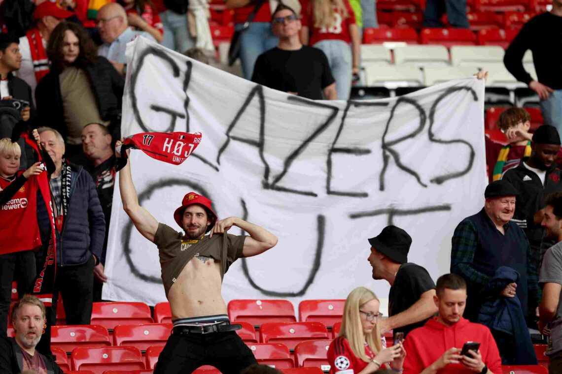 MANCHESTER, ENGLAND - OCTOBER 07: Manchester United fans show their support while holding a banner which reads 'Glazers Out' following their sides ...