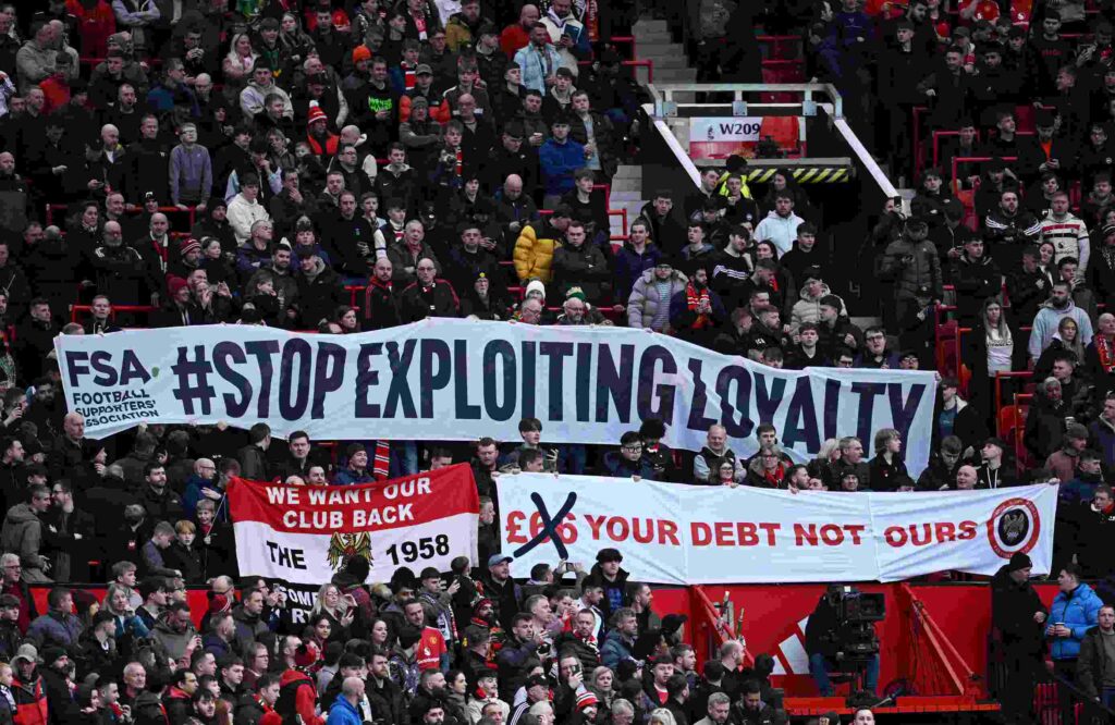 MANCHESTER, ENGLAND - MARCH 02: Fans of Manchester United display banners in protest of rising ticket prices prior to the Emirates FA Cup Fifth Round match between Manchester United and Fulham at Old Trafford on March 02, 2025 in Manchester, England. (Photo by Justin Setterfield/Getty Images)