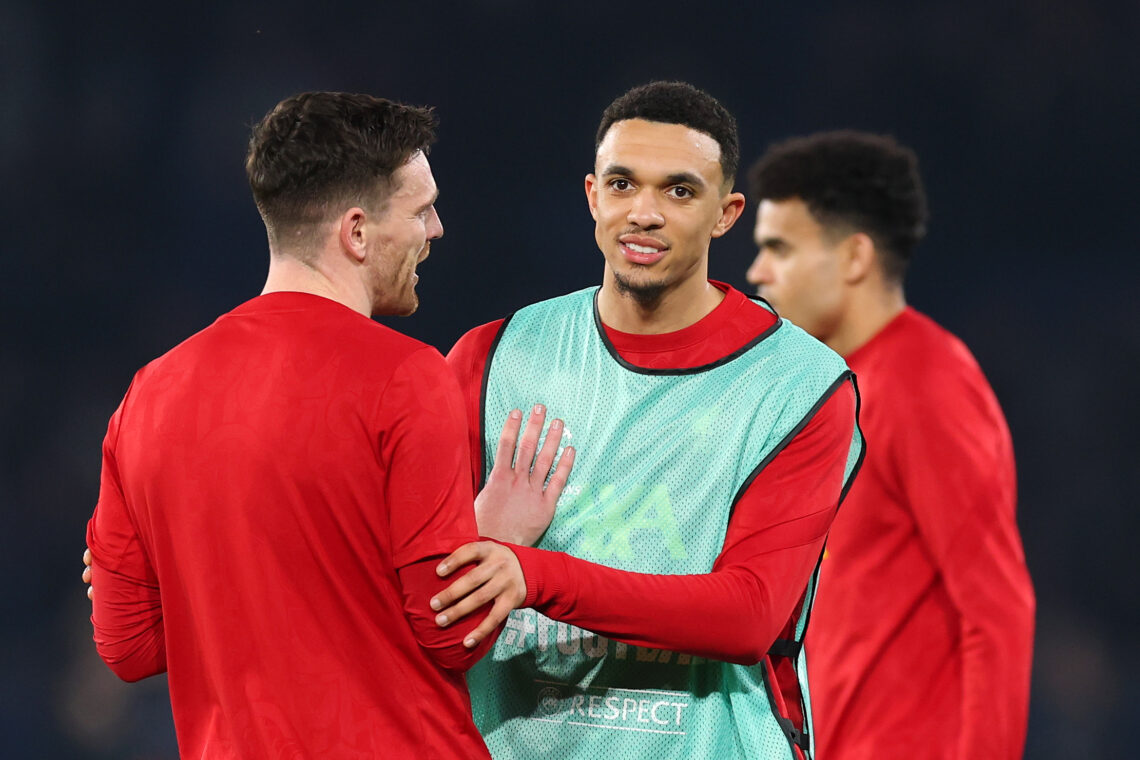 PARIS, FRANCE - MARCH 05: Trent Alexander-Arnold of Liverpool (R) speaks with teammate Andrew Robertson in the warm-up prior to the UEFA Champions ...