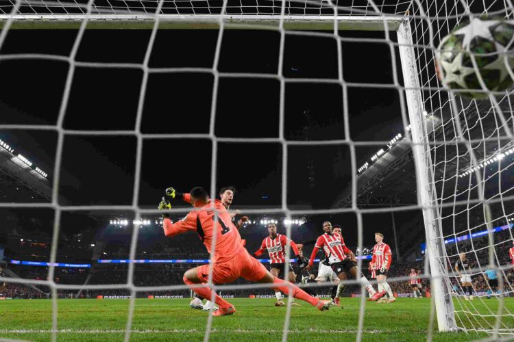 EINDHOVEN, NETHERLANDS - MARCH 04: Walter Benitez of PSV Eindhoven fails a save a shot from Ethan Nwaneri of Arsenal as he scores his teams second ...