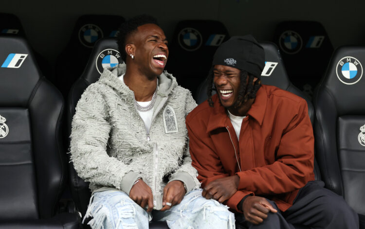 MADRID, SPAIN - DECEMBER 01: Vinicius Junior and Eduardo Camavinga of Real Madrid react from the substitutes bench prior to the LaLiga match betwee...
