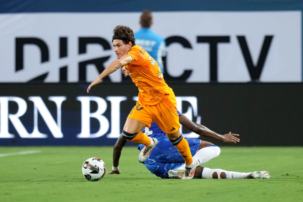 CHARLOTTE, NORTH CAROLINA - AUGUST 06: Fran García #20 of Real Madrid battles Noni Madueke #11 of Chelsea for possession during a pre-season friendly match at Bank of America Stadium on August 06, 2024 in Charlotte, North Carolina. (Photo by Grant Halverson/Getty Images)