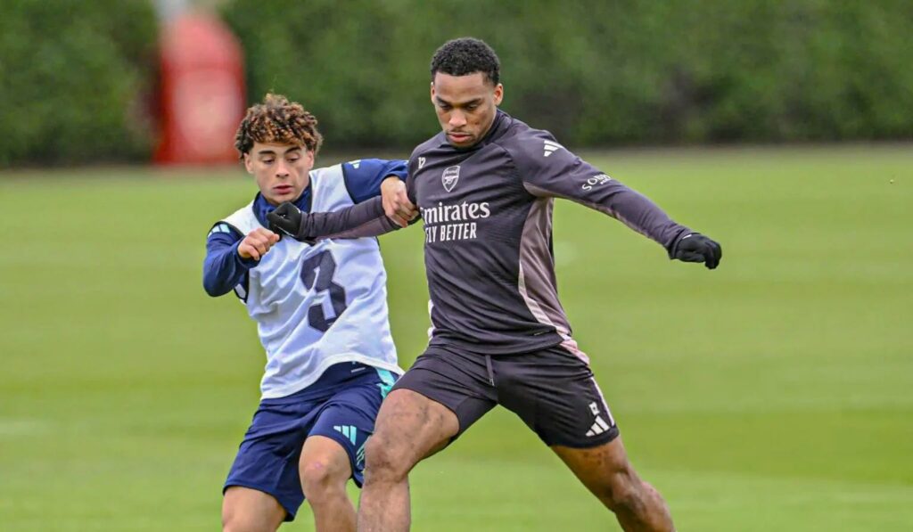 Marcell Washington battling with Jurrien Timber for possession in training with Arsenal