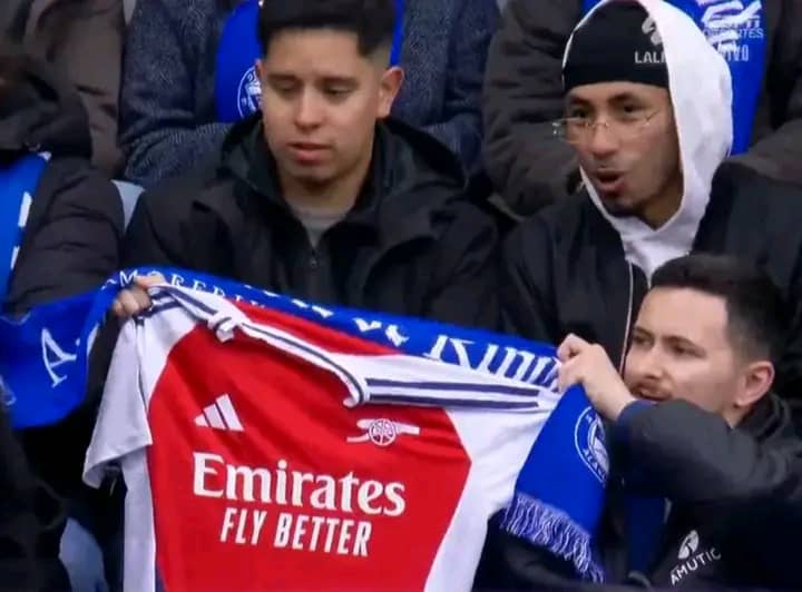 Alaves fans hold up an Arsenal shirt during their match against Real Madrid