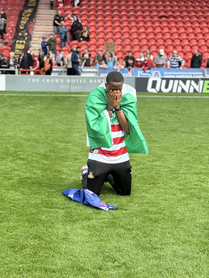 Joseph Olowu celebrates promotion to League One (Photo via Olowu on Twitter)