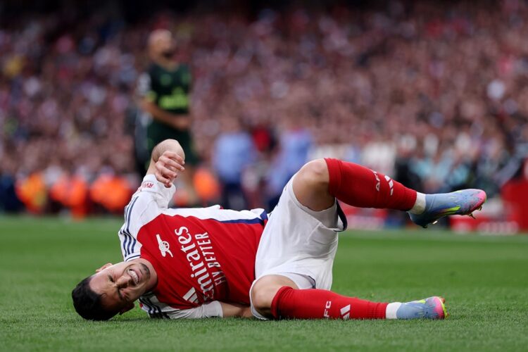 LONDON, ENGLAND: Gabriel Martinelli of Arsenal goes down with an injury during the Premier League match between Arsenal FC and Brentford FC at Emir...
