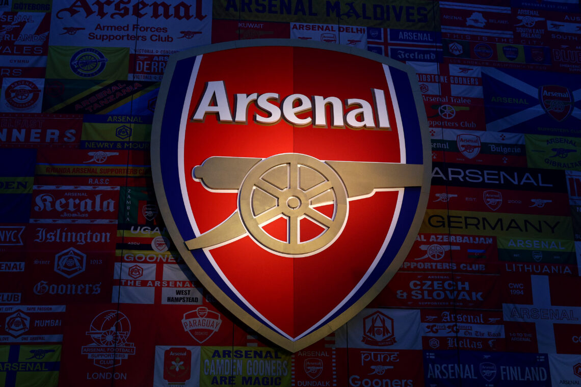 LONDON, ENGLAND - MARCH 01: : A detailed view of the Arsenal badge with the "We All Follow The Arsenal" stadium wrap around the stadium prior to th...