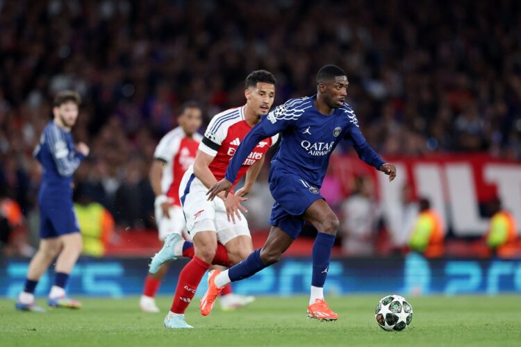 LONDON, ENGLAND: Ousmane Dembele of Paris Saint-Germain runs with the ball whilst under pressure from William Saliba of Arsenal during the UEFA Cha...
