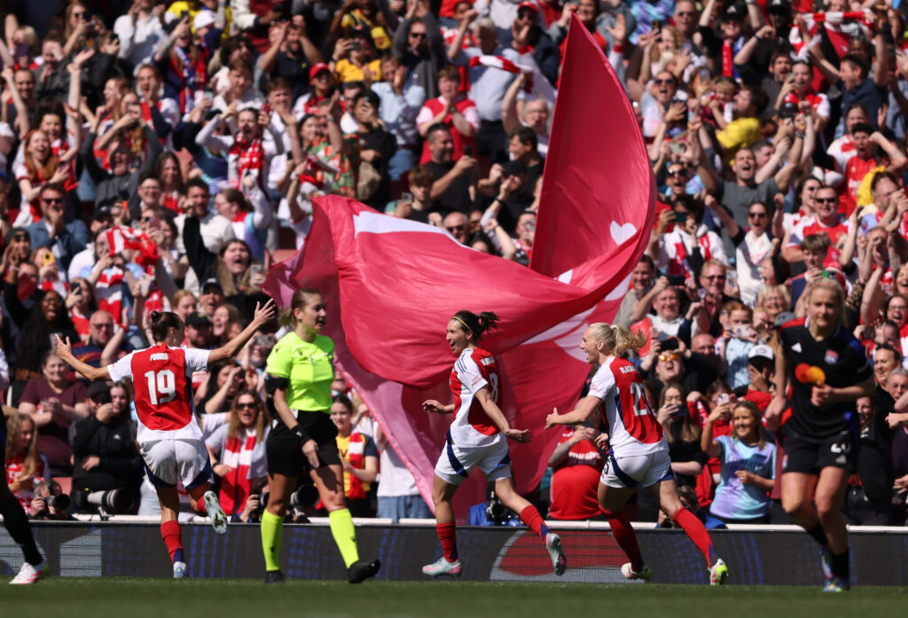LONDON, ENGLAND - APRIL 19: Mariona Caldentey of Arsenal celebrates scoring her team's first goal with teammates Caitlin Foord and Stina Blackstenius during the UEFA Women's Champions League semifinal first leg match between Arsenal WFC and Olympique Lyonnais on April 19, 2025 in London, England. (Photo by Paul Harding/Getty Images)