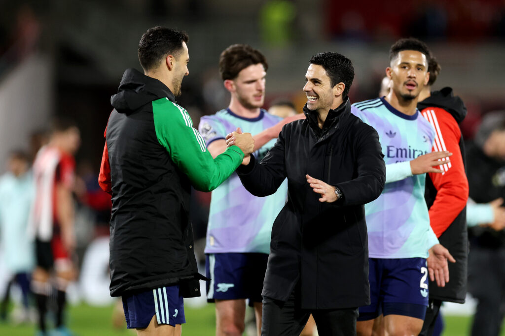 BRENTFORD, ENGLAND - JANUARY 01: Mikel Arteta, Manager of Arsenal, interacts with Mikel Merino of Arsenal after the Premier League match between Brentford FC and Arsenal FC at the Brentford Community Stadium on January 01, 2025 in Brentford, England. (Photo by Richard Heathcote/Getty Images)