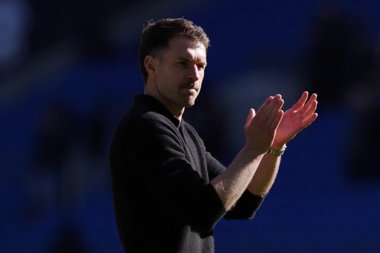 CARDIFF, WALES: Aaron Ramsey, Interim Manager of Cardiff City, applauds the fans after Cardiff City draw with Oxford United following a 1-1 result ...