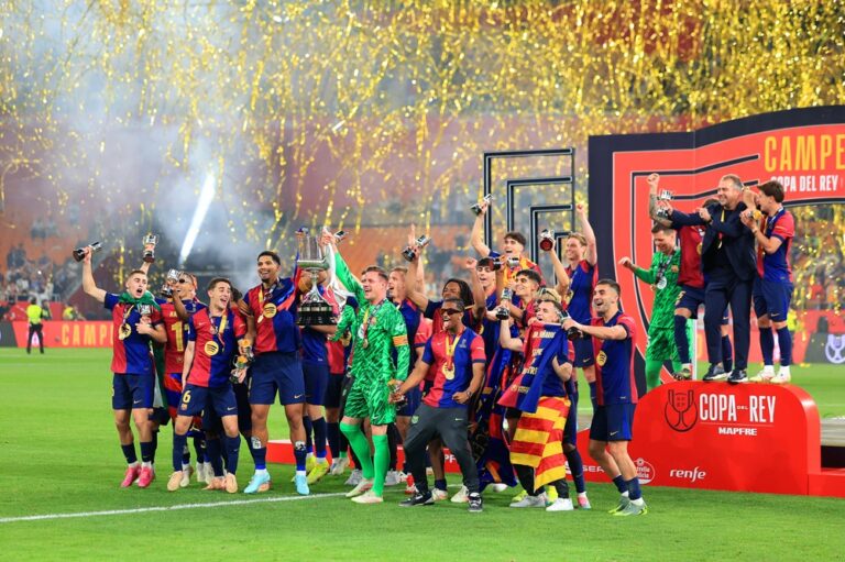 SEVILLE, SPAIN: Ronald Araujo and Marc-Andre ter Stegen of FC Barcelona lift the Copa del Rey trophy after the team's victory in the Copa del Rey Final match between FC Barcelona and Real Madrid at Estadio de La Cartuja on April 26, 2025. (Photo by Fran Santiago/Getty Images)