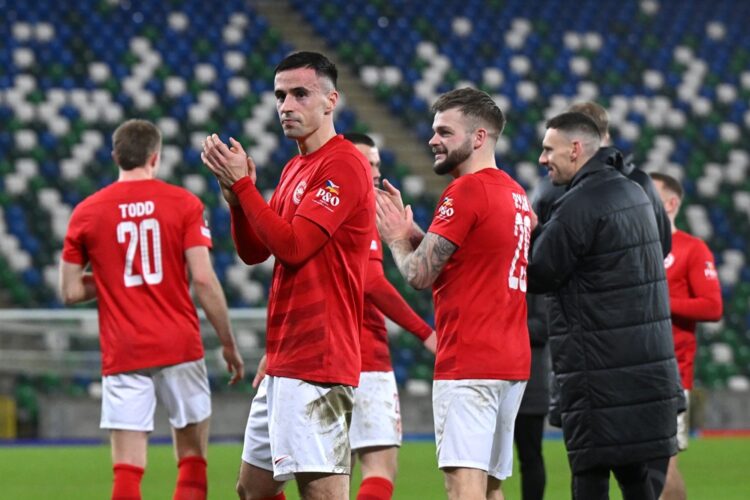 BELFAST, NORTHERN IRELAND: Jordan McEneff of Larne FC shows appreciation to the fans following the UEFA Conference League 2024/25 League Phase MD6 ...