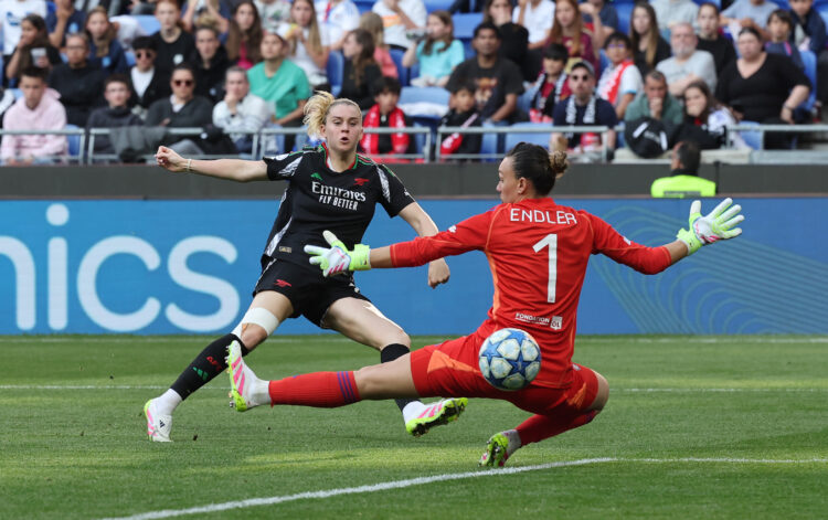 DECINES-CHARPIEU, FRANCE - APRIL 27: Alessia Russo of Arsenal scores her team's third goal past Christiane Endler of Olympique Lyonnais during the ...