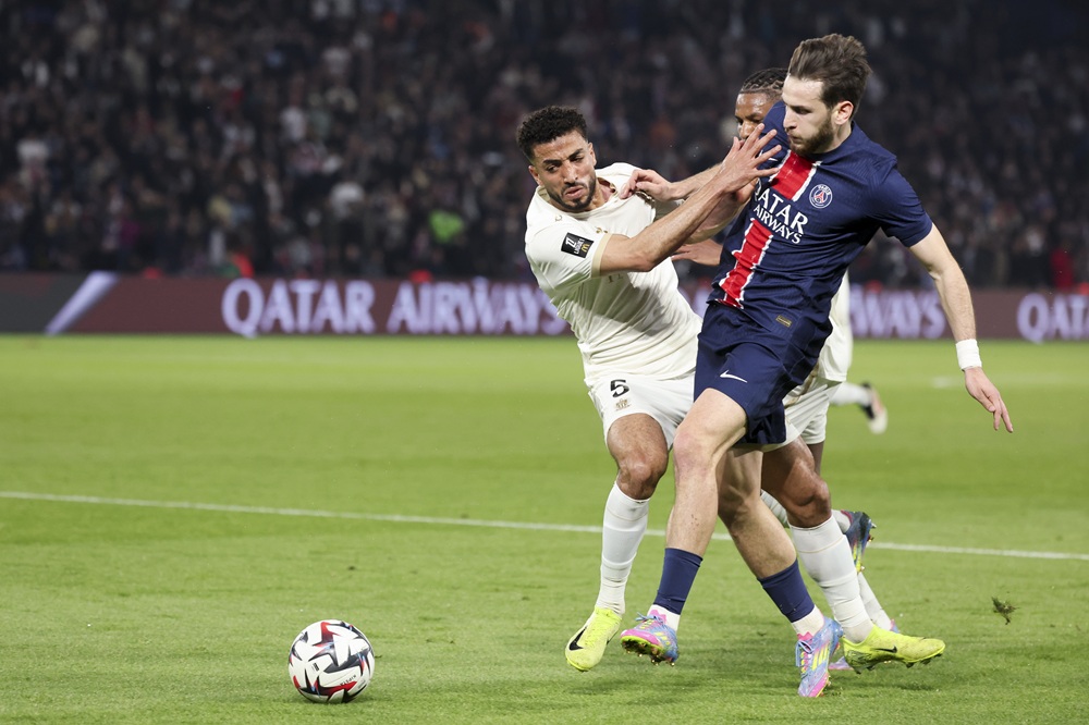 PARIS, FRANCE: Mohamed Abdelmoneim Ahmed of OGC Nice challenges Khvicha Kvaratskhelia of Paris Saint-Germain during the Ligue 1 match between Paris...
