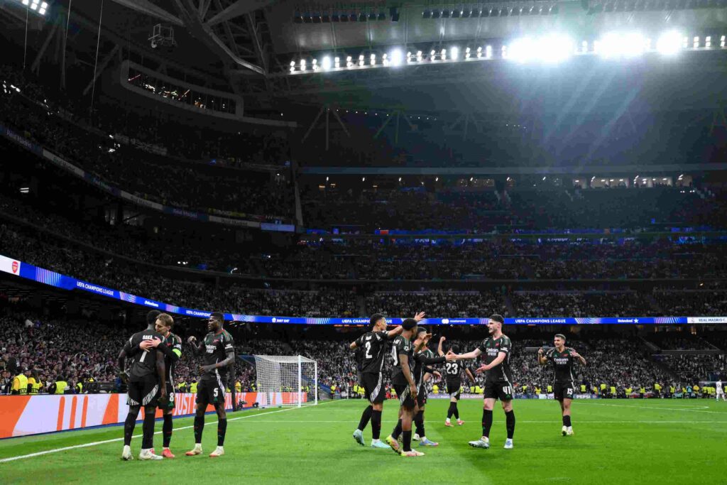 MADRID, SPAIN - APRIL 16: Bukayo Saka of Arsenal celebrates scoring his team's first goal with teammate Martin Odegaard during the UEFA Champions League 2024/25 Quarter Final Second Leg match between Real Madrid C.F. and Arsenal FC at Estadio Santiago Bernabeu on April 16, 2025 in Madrid, Spain. (Photo by David Ramos/Getty Images)