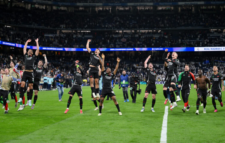 MADRID, SPAIN - APRIL 16: Players of Arsenal celebrate victory following the UEFA Champions League 2024/25 Quarter Final Second Leg match between R...