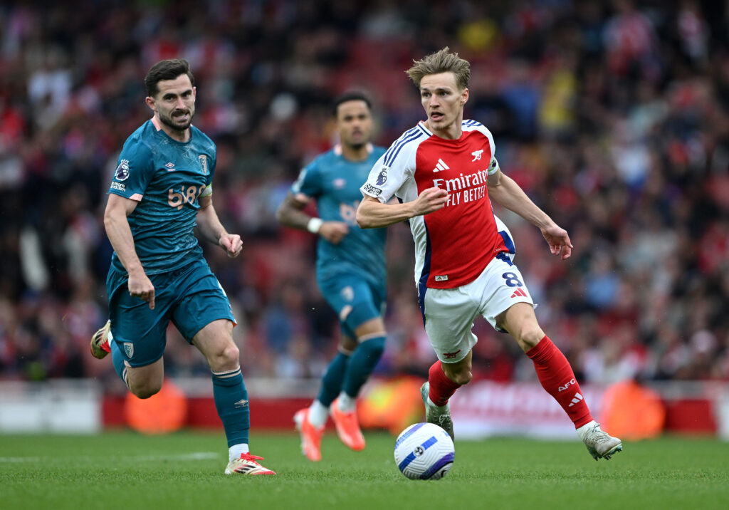 LONDON, ENGLAND - MAY 03: Martin Odegaard of Arsenal breaks away from Lewis Cook of AFC Bournemouth during the Premier League match between Arsenal FC and AFC Bournemouth at Emirates Stadium on May 03, 2025 in London, England. (Photo by Shaun Botterill/Getty Images)