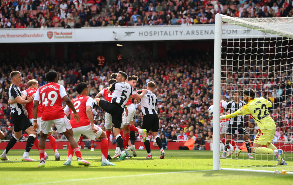 Arsenal beat Newcastle to secure Champions League football 4 LONDON, ENGLAND - MAY 18: Dan Burn of Newcastle United creates a headed chance which is saved by David Raya of Arsenal during the Premier League match between Arsenal FC and Newcastle United FC at Emirates Stadium on May 18, 2025 in London, England. (Photo by Mike Hewitt/Getty Images)