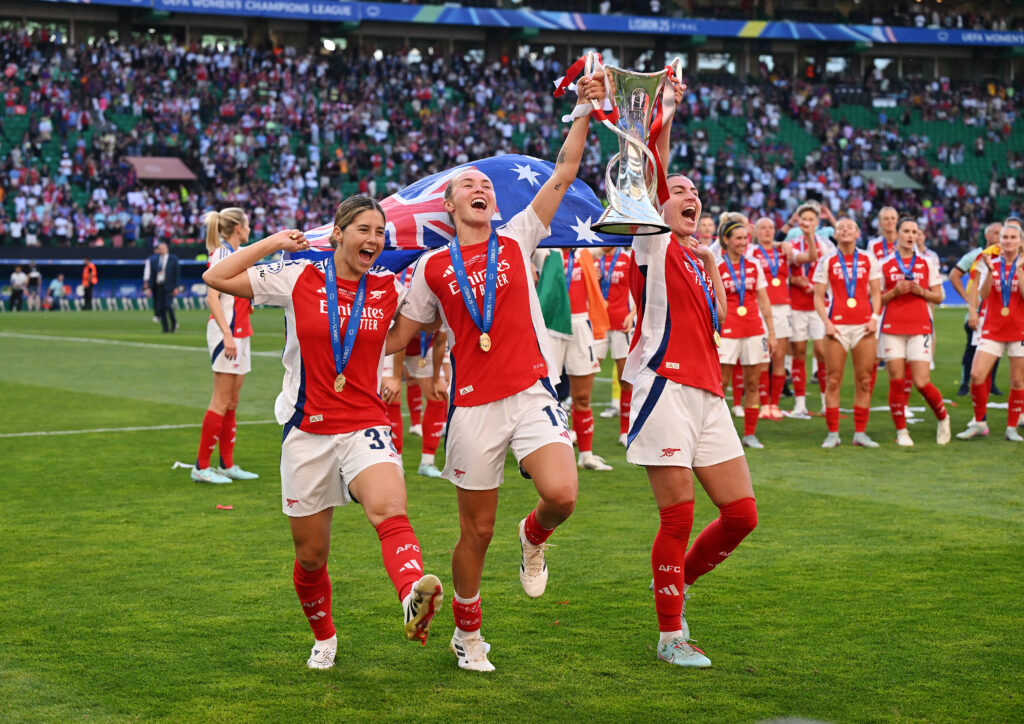 Arsenal defy the odds to win the Champions League 3 LISBON, PORTUGAL - MAY 24: Kyra Cooney-Cross, Caitlin Foord and Mariona Caldentey of Arsenal celebrate with the UEFA Women's Champions League trophy after the UEFA Women's Champions League final match between Arsenal WFC and FC Barcelona at Estadio Jose Alvalade on May 24, 2025 in Lisbon, Portugal. (Photo by David Ramos/Getty Images)