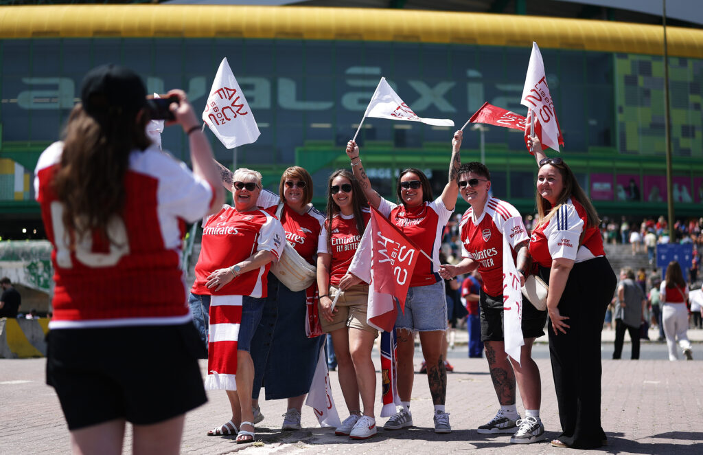 LISBON, PORTUGAL - MAY 24: Arsenal fans pose for a photo outside the stadium prior to the UEFA Women's Champions League final match between Arsenal WFC and FC Barcelona at Estadio Jose Alvalade on May 24, 2025 in Lisbon, Portugal. (Photo by Maja Hitij/Getty Images)