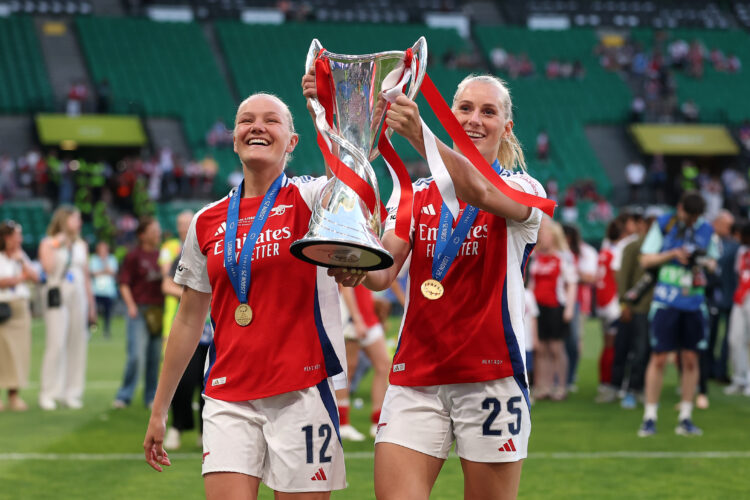 LISBON, PORTUGAL - MAY 24: Frida Maanum and Stina Blackstenius of Arsenal lift the UEFA Women's Champions League trophy after their team's victory ...