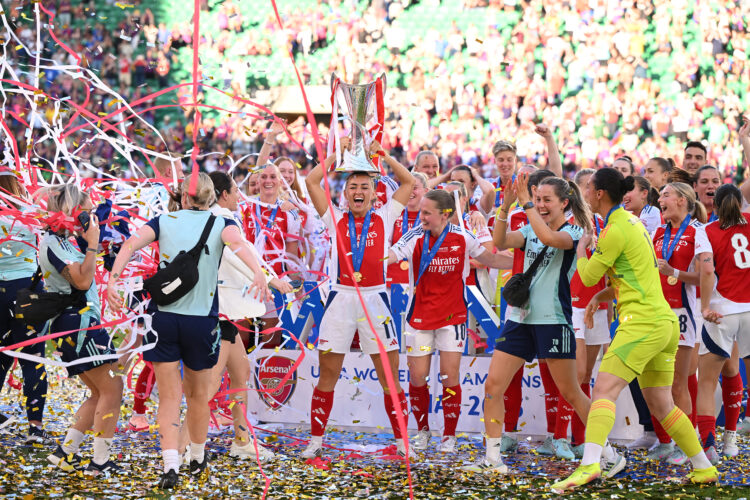 LISBON, PORTUGAL - MAY 24: Katie McCabe of Arsenal lifts the UEFA Women's Champions League trophy after her team's victory in the UEFA Women's Cham...