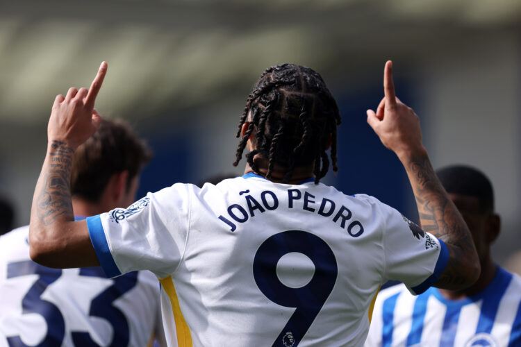 BRIGHTON, ENGLAND - APRIL 12: Joao Pedro of Brighton & Hove Albion celebrates scoring his team's first goal from the penalty spot during the Pr...