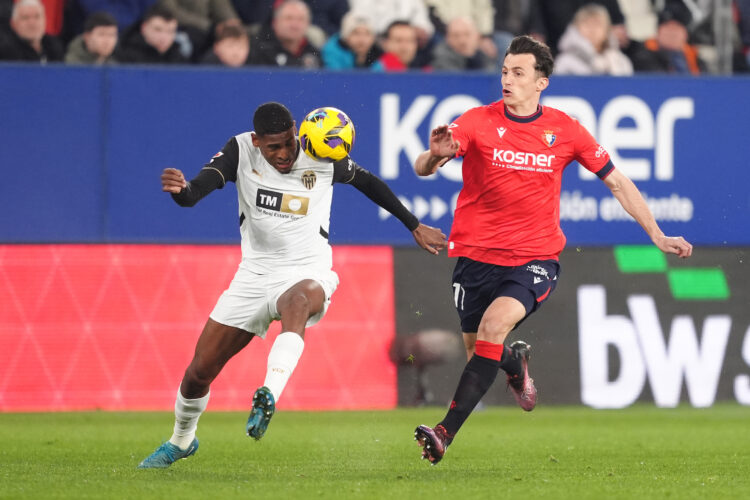 PAMPLONA, SPAIN - MARCH 02: Cristhian Mosquera of Valencia CF battles for possession with Ante Budimir of CA Osasuna during the LaLiga match betwee...