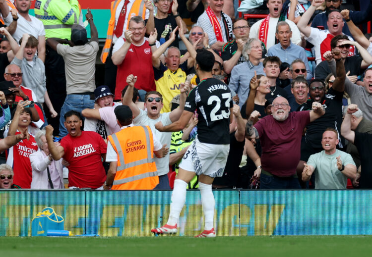 LIVERPOOL, ENGLAND - MAY 11: Mikel Merino of Arsenal celebrates scoring his team's second goal in front of the Arsenal fans during the Premier Leag...