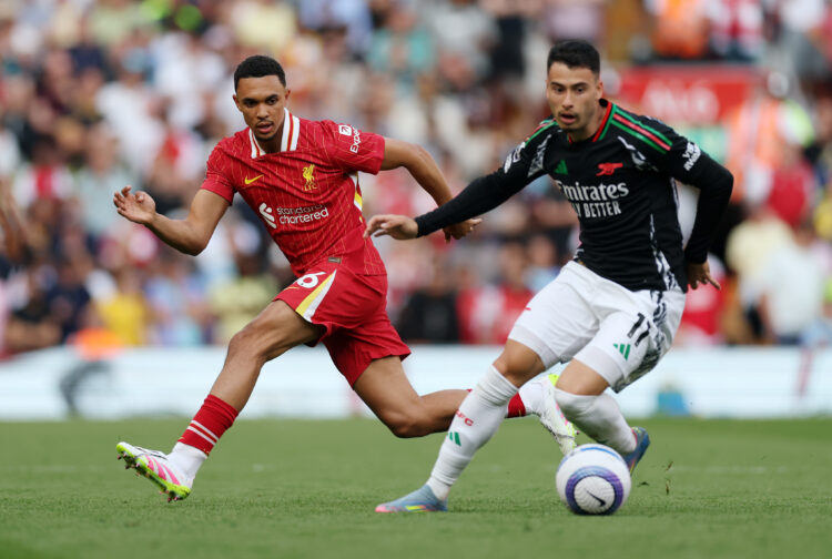 LIVERPOOL, ENGLAND - MAY 11: Trent Alexander-Arnold of Liverpool watches on as Gabriel Martinelli of Arsenal runs with the ball during the Premier ...