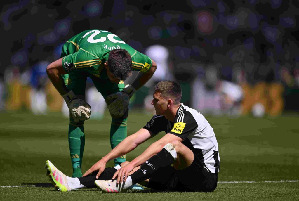 NEWCASTLE UPON TYNE, ENGLAND - MAY 11: Nick Pope shows concern to Sven Botman of Newcastle United after the defender went down with an injury during the Premier League match between Newcastle United FC and Chelsea FC at St James' Park on May 11, 2025 in Newcastle upon Tyne, England. (Photo by Stu Forster/Getty Images)