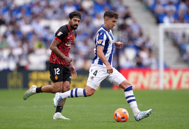 SAN SEBASTIAN, SPAIN: Martin Zubimendi of Real Sociedad runs with the ball whilst under pressure from Samu Costa of RCD Mallorca during the LaLiga ...