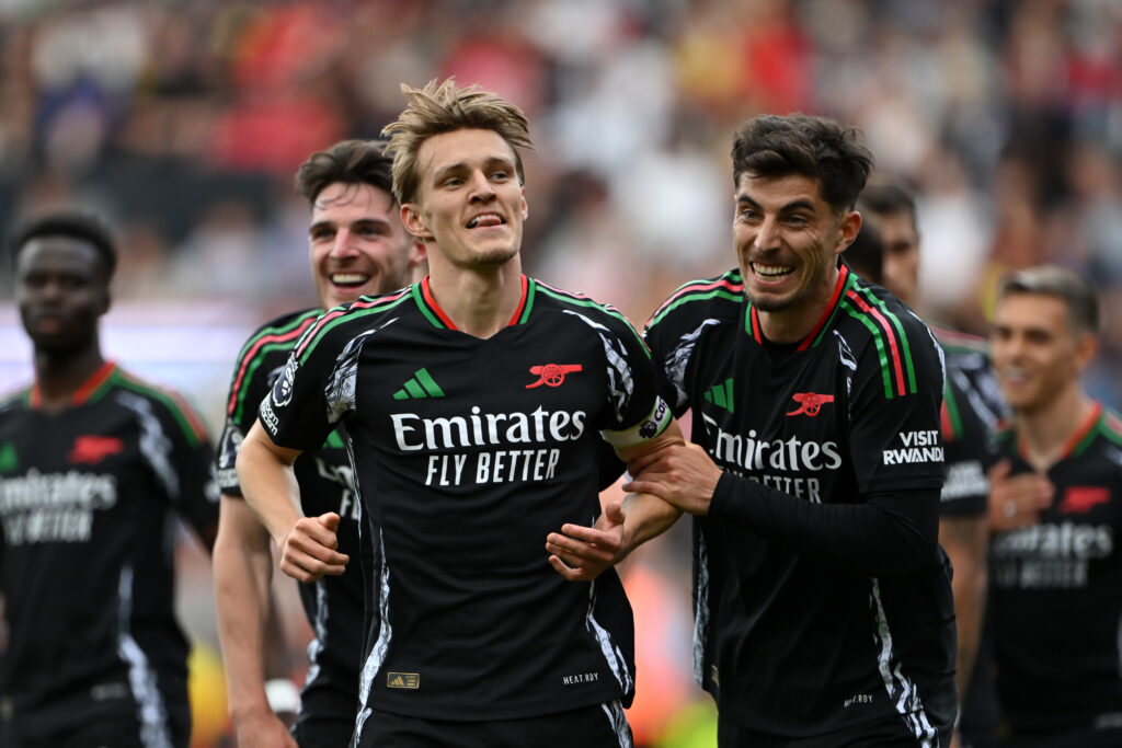 SOUTHAMPTON, ENGLAND - MAY 25: Martin Odegaard of Arsenal celebrates scoring his team's second goal with teammates during the Premier League match between Southampton FC and Arsenal FC at St Mary's Stadium on May 25, 2025 in Southampton, England. (Photo by Dan Mullan/Getty Images)