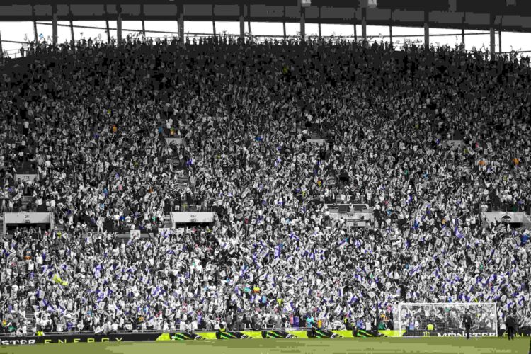 A general view as fans of Tottenham Hotspur wave small flags in the stands prior to the Premier League match between Tottenham Hotspur FC and Brigh...
