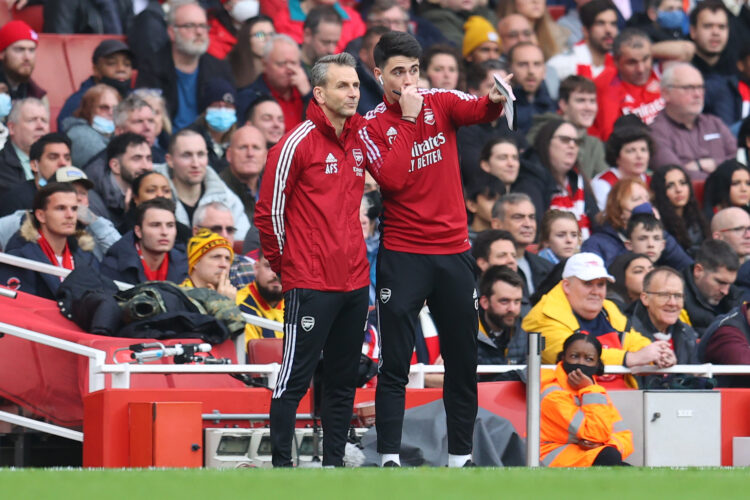 LONDON, ENGLAND - JANUARY 01: Arsenal Assistant Manager Albert Stuivenberg talks to Carlos Cuesta, First team coach who is thought to be in direct ...