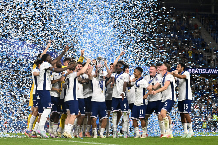 BRATISLAVA, SLOVAKIA - JUNE 28: James McAtee of England lifts the UEFA European Under-21 Championship trophy after his team's victory in the UEFA E...