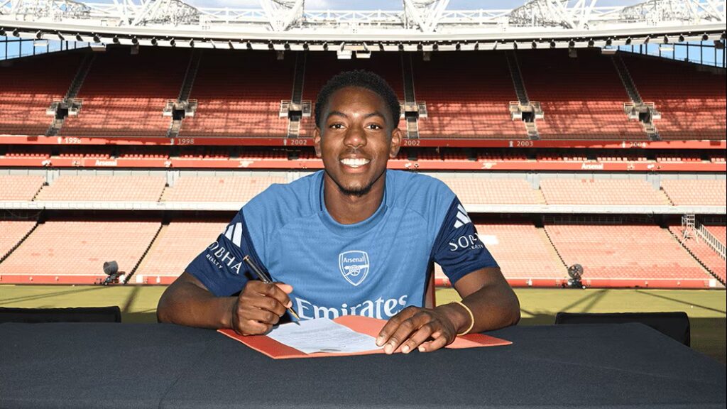 How Lewis-Skelly responded to Real Madrid interest 4 Myles Lewis-Skelly signs his Arsenal contract (Photo via Arsenal)