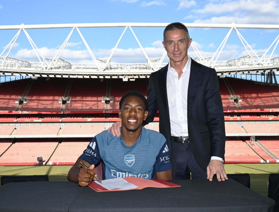 How Lewis-Skelly responded to Real Madrid interest 2 Myles Lewis-Skelly signs his Arsenal contract alongside Andrea Berta (Photo via Arsenal)