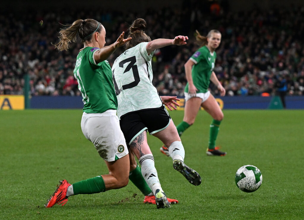 DUBLIN, IRELAND - DECEMBER 03: Rachel Rowe of Wales is tackled by Katie McCabe of Republic of Ireland during the UEFA Women's EURO 2025 Play-Off Round Two Second Leg match between Republic of Ireland and Wales at Aviva Stadium on December 03, 2024 in Dublin, Ireland. (Photo by Charles McQuillan/Getty Images)
