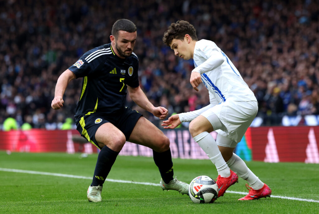 GLASGOW, SCOTLAND - MARCH 23: John McGinn of Scotland battles for possession with Konstantinos Karetsas of Greece during the UEFA Nations League 2024/25 League A/B Play-offs Second Leg match between Scotland and Greece at Hampden Park on March 23, 2025 in Glasgow, Scotland. (Photo by Ian MacNicol/Getty Images)