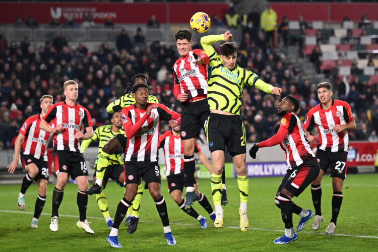 BRENTFORD, ENGLAND - NOVEMBER 25: Christian Norgaard of Brentford heads clear under a challenge from Kai Havertz of Arsenal during the Premier Leag...