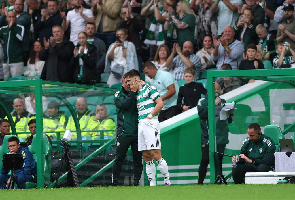 GLASGOW, SCOTLAND - JULY 19: Celtic player Kieran Tierney is embraced by manager Brendan Rodgers before coming on as a substitute during the pre-season friendly match between Celtic and Newcastle United at Celtic Park on July 19, 2025 in Glasgow, Scotland. (Photo by Stu Forster/Getty Images)