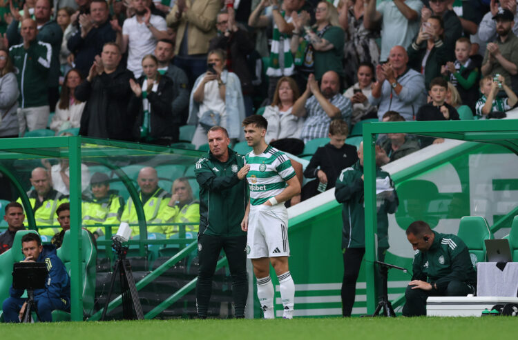 GLASGOW, SCOTLAND - JULY 19: Celtic player Kieran Tierney is embraced by manager Brendan Rodgers before coming on as a substitute during the pre-se...