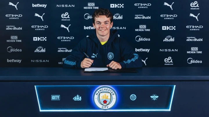 Sverre Nypan signing for Manchester City (Photo via ManCity.com)
