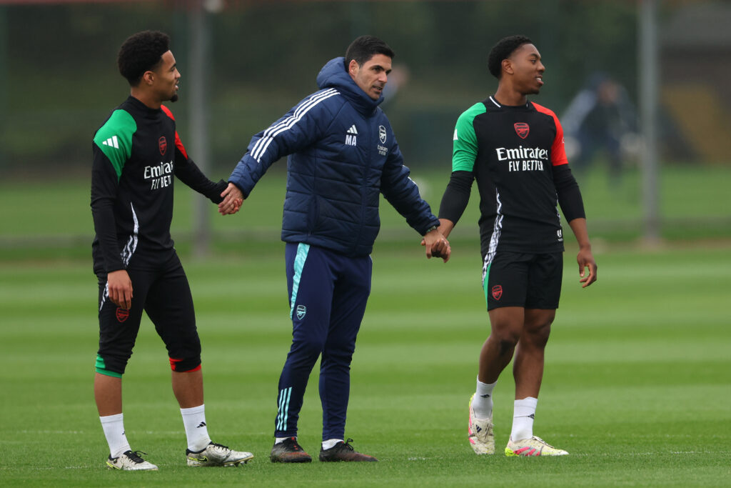 Arteta appointed as Under Armour Director of Performance 3 LONDON COLNEY, ENGLAND - APRIL 15: Mikel Arteta, Manager of Arsenal, links hands with Ethan Nwaneri and Myles Lewis-Skelly of Arsenal during a training session ahead of their UEFA Champions League 2024/25 quarter final second leg match at Sobha Realty Training Centre on April 15, 2025 in London Colney, England. (Photo by Harry Murphy/Getty Images)