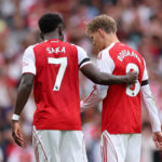 LONDON, ENGLAND - AUGUST 23: Bukayo Saka of Arsenal consoles Martin Odegaard of Arsenal as he is substituted off during the Premier League match between Arsenal and Leeds United at Emirates Stadium on August 23, 2025 in London, England. (Photo by Julian Finney/Getty Images)