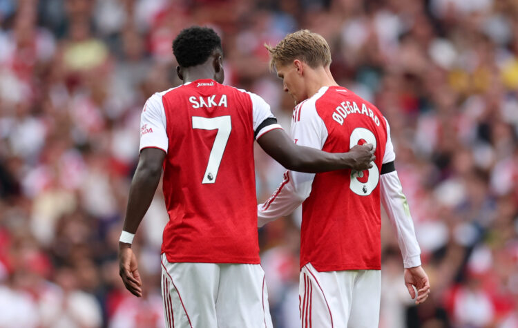 LONDON, ENGLAND - AUGUST 23: Bukayo Saka of Arsenal consoles Martin Odegaard of Arsenal as he is substituted off during the Premier League match be...