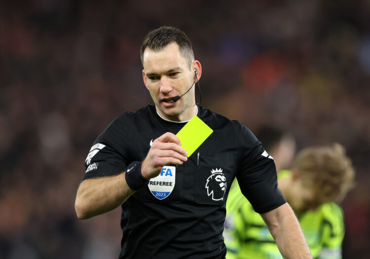 BIRMINGHAM, ENGLAND - DECEMBER 09: Referee Jarred Gillett with a yellow card during the Premier League match between Aston Villa and Arsenal FC at ...